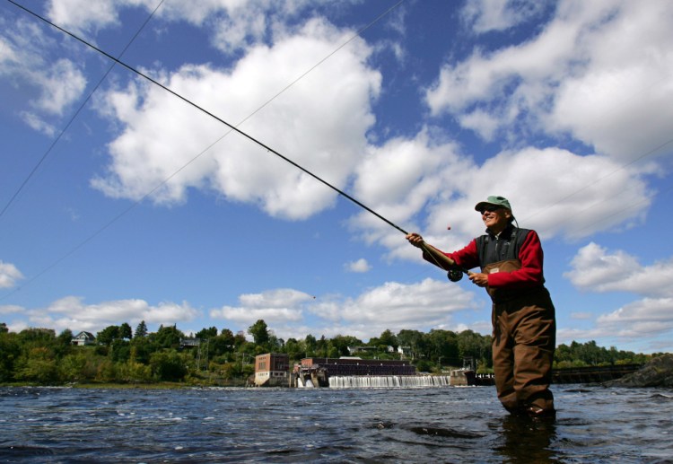 A fisherman casts for Atlantic salmon in the Penobscot River below the Veazie Dam in Eddington.