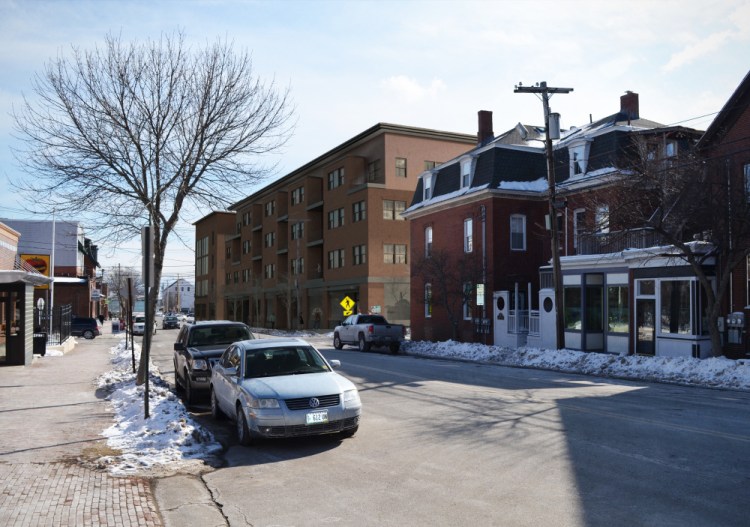 The four-story condominium project, depicted at rear, would require the demolition of Port City Glass at 62 India St.