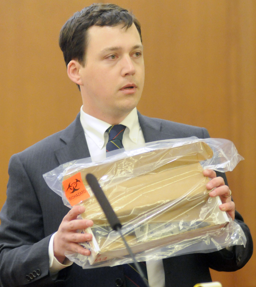Defense attorney Caleb Gannon holds a knife that he claims Jillian Jones assaulted Justin Pillsbury with at their Augusta apartment.