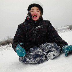 Cyndimae Meehan slides in the snow shortly after moving to Maine. Her epilepsy left her “a shell of a child” before cannabis treatment allowed her to run, laugh and swim.