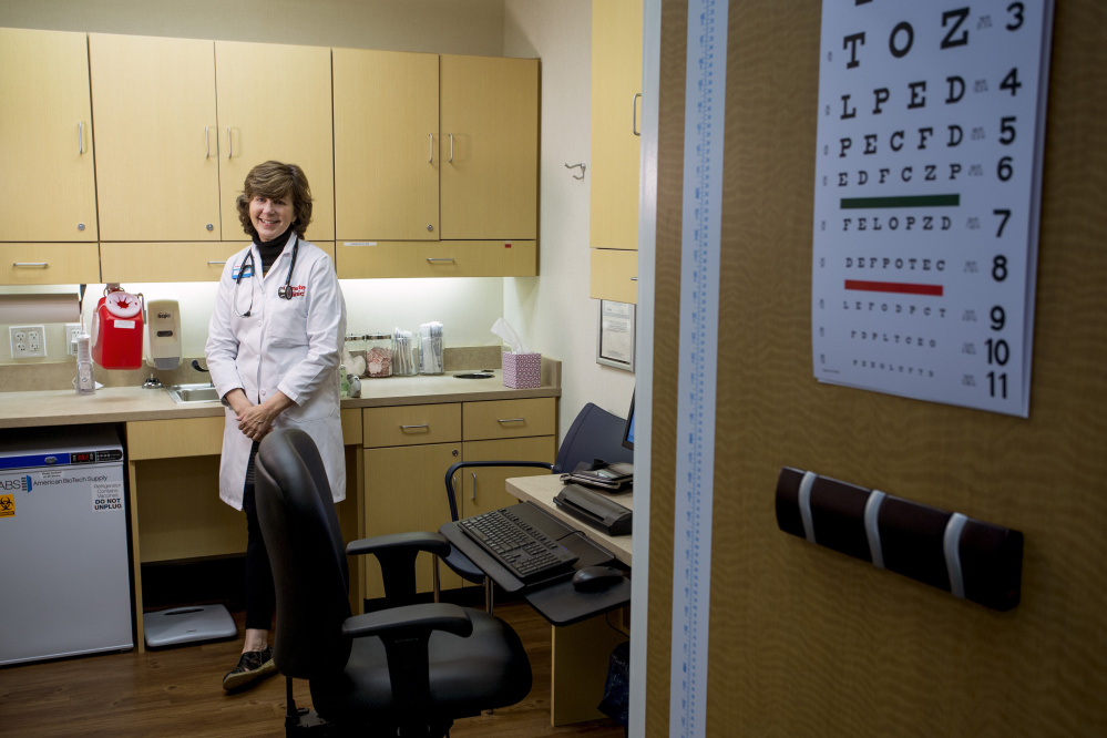 Photos by Gabe Souza/Staff Photographer
Katheryn Kendall, a family nurse practitioner, waits for a patient in an exam room at the CVS Minute Clinic in South Portland.