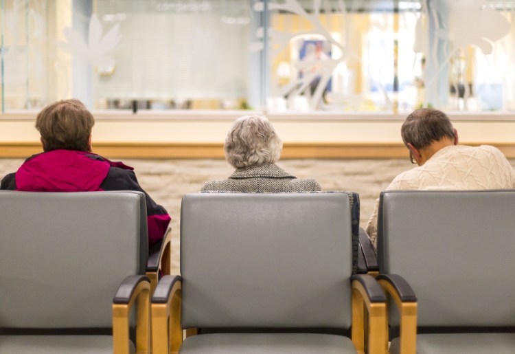 Patients sit in a waiting room at Southern Maine Health Care in Biddeford.