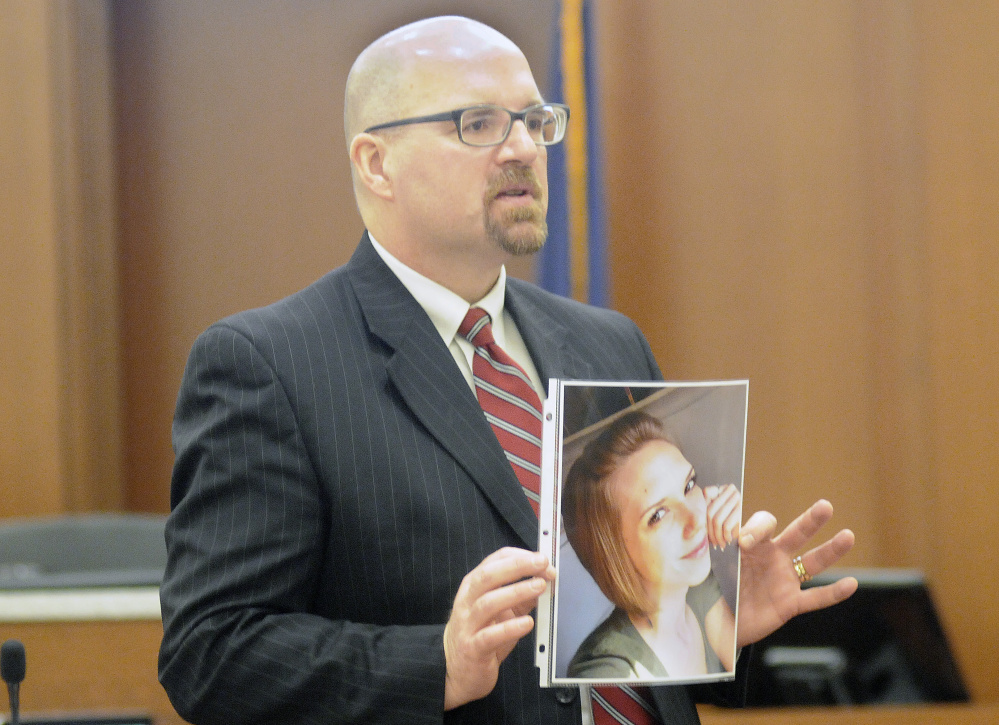 Assistant Attorney General Donald Macomber holds a photo of Jillian Jones during opening arguments Monday in the murder trial of Justin Pillsbury. His lawyer says Pillsbury was defending himself from Jones, who died of several stab wounds at their Augusta apartment in November 2013.