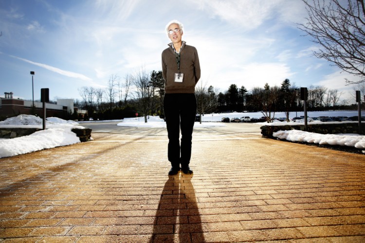 Cliff Rosen, M.D., who has been conducting clinical research for 10 years on the effects of vitamin D, soaks up some welcome sunlight in January outside the Maine Medical Center research building in Scarborough.