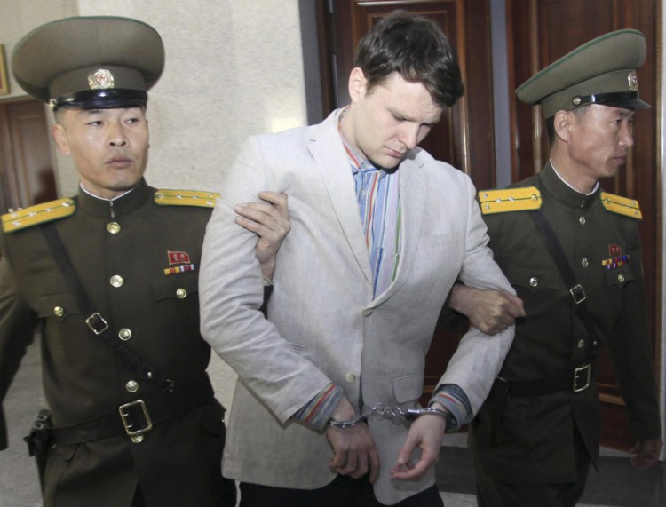 American student Otto Warmbier  is escorted at the Supreme Court in Pyongyang, North Korea, on March 16, 2016.