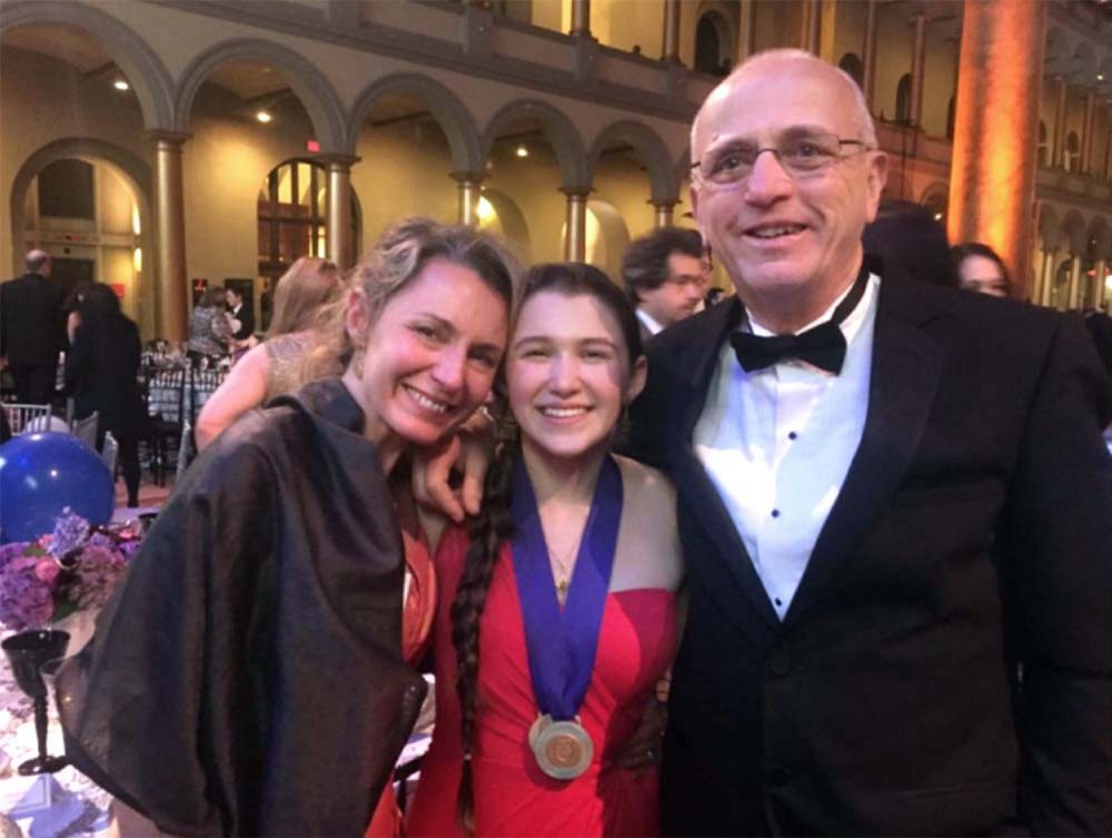 Bangor High School senior Paige Brown, center, pictured with her mother, Heather, and teacher Cary James at the Intel Science Talent Search awards ceremony in March, took first place in the environmental engineering category for her science project on removing phosphorous from water.