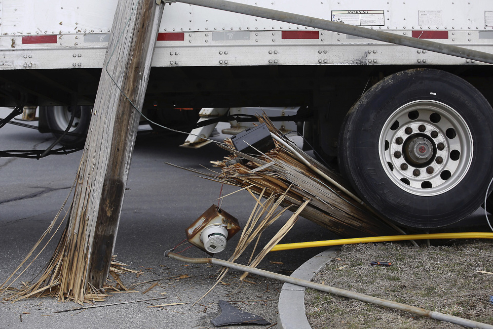 Electricity to a number of homes and businesses in South Portland was disrupted Wednesday after a tractor-trailer truck hit a utility pole.