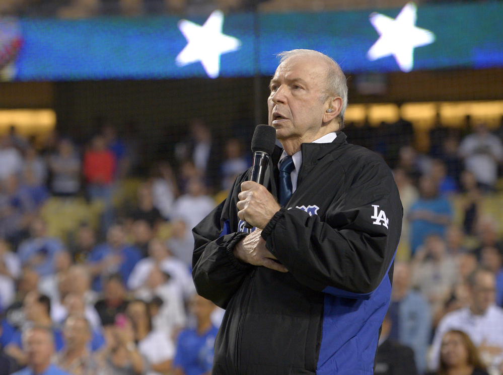 In this Sept. 18, 2015, file photo, Frank Sinatra Jr. sings the national anthem prior to a baseball game between the Los Angeles Dodgers and the Pittsburgh Pirates in Los Angeles. Sinatra Jr., who carried on his famous father’s legacy with his own music career, died Wednesday. He was 72.