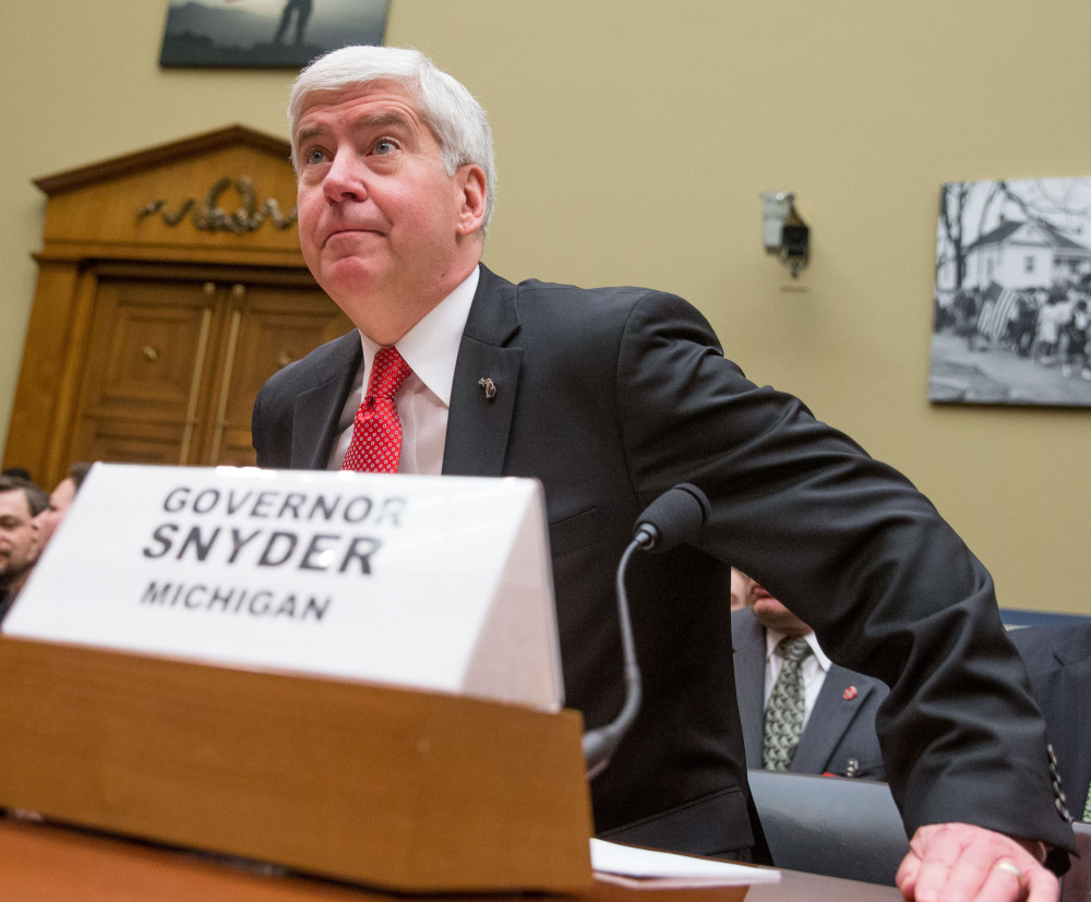 Michigan Gov. Rick Snyder arrives to testify before the  House Oversight and Government Reform Committee in Washington on  Thursday.