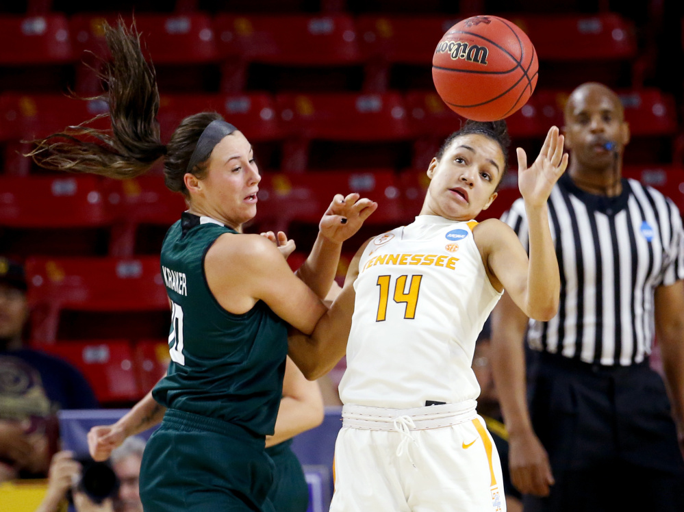 Tennessee guard Andraya Carter, right, knocks the ball away from Wisconsin-Green Bay’s Mehryn Kraker during a first-round game Friday in the NCAA women’s basketball tournament in Tempe, Arizona. Tennessee won, 59-53.
