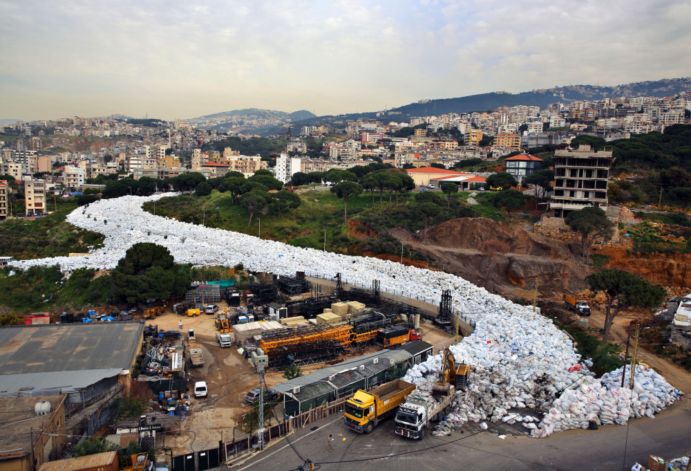 A veritable river of garbage has been flowing in east Beirut since July when a dump was closed with no realistic alternatives at the city’s disposal. Finally, on Saturday, public workers began removing the refuse and moving it to the dump, which was reopened for two months.