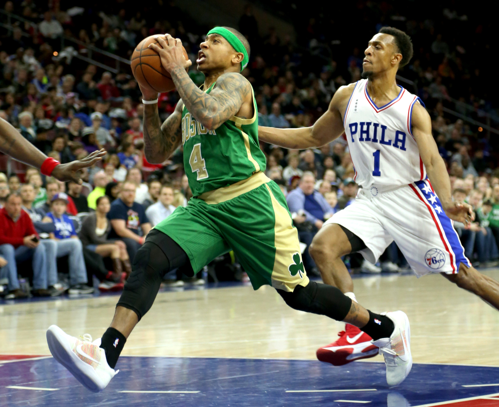 Celtics guard Isaiah Thomas drives to the basket past 76ers guard Ish Smith during Boston’s 120-105 win Sunday in Philadelphia. Thomas finished with 26 points.