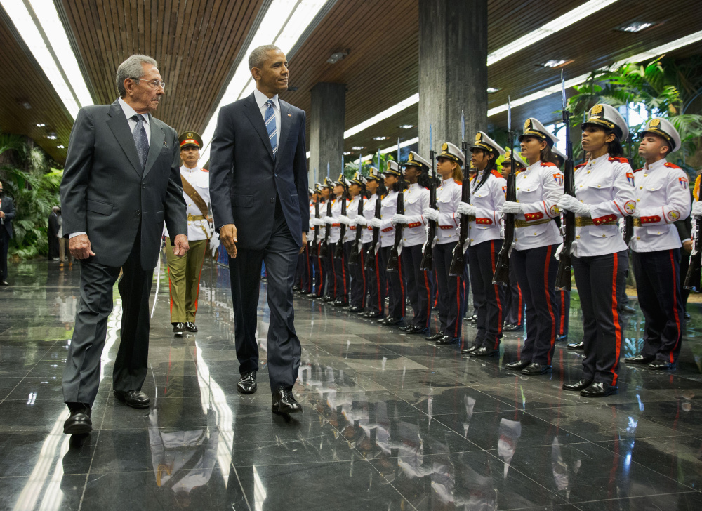 President Barack Obama and Cuban President Raul Castro, left, walk during a welcoming ceremony at the Palace of the Revolution, Monday, March 21, 2016, in Havana, Cuba. (AP Photo/Pablo Martinez Monsivais)