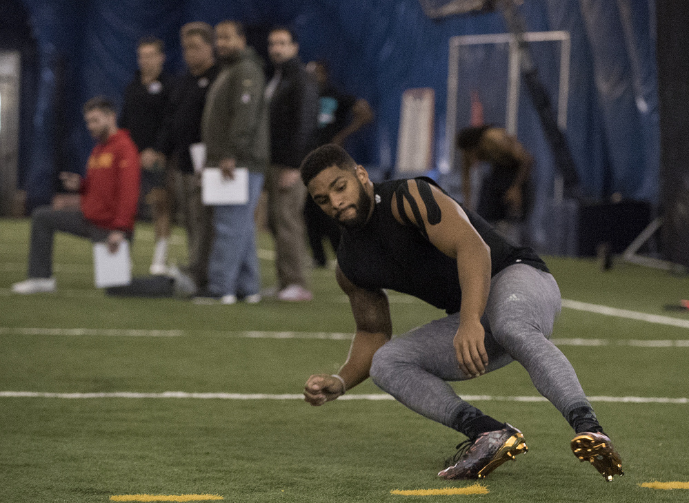 Trevor Bates, a Westbrook native, runs a shuttle excercise for NFL scouts Monday during the annual pro day at UMaine. Bates hopes to catch on at one of the linebacker positions.