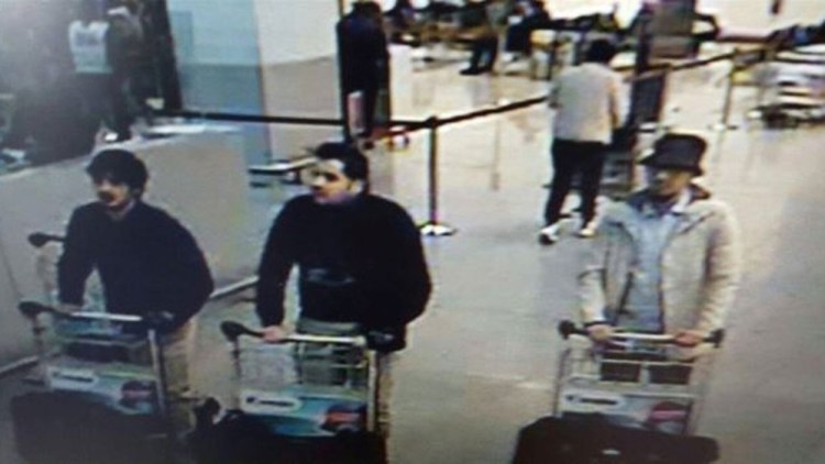 Surveillance video cameras caught these three men pushing carts at the Brussels airport before the two explosions there. The Associated Press