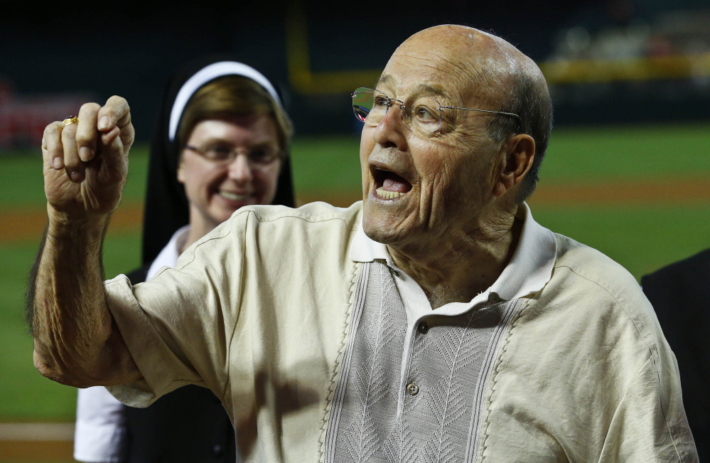 Arizona Diamondbacks broadcaster Joe Garagiola laughs during festivities honoring the former player and broadcaster prior to a baseball game against the Los Angeles Dodgers, on Sunday, April 14, 2013 in Phoenix.  The game was Garagiola’s last as a broadcaster as he announced his retirement. (AP Photo/Ross D. Franklin)