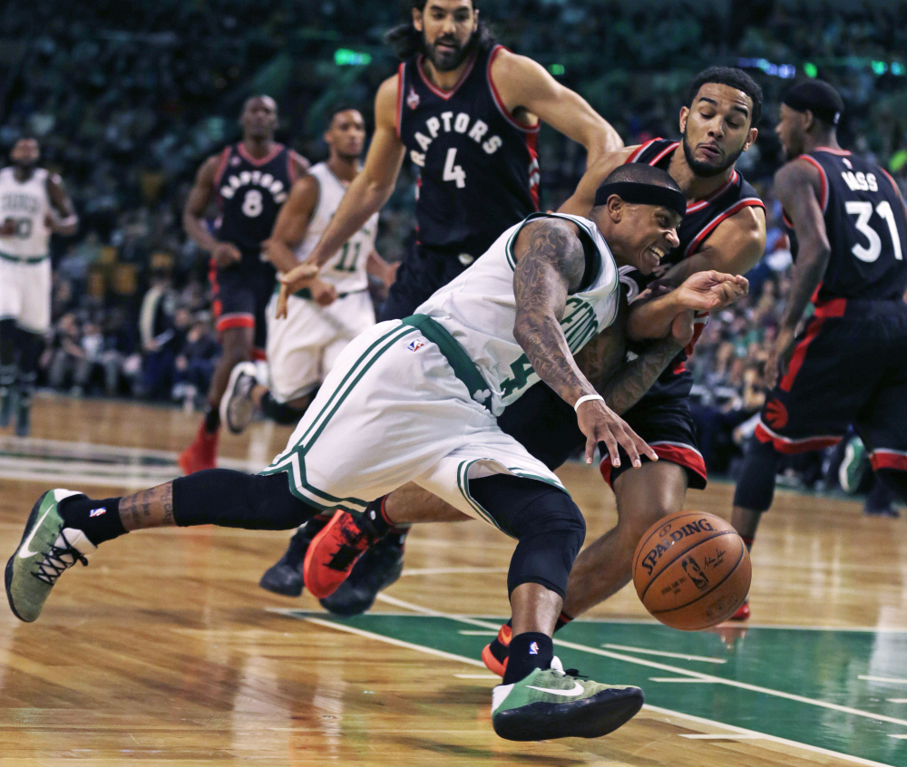 Celtics guard Isaiah Thomas drives to the basket against Toronto’s Cory Joseph in the first quarter of Wednesday night’s game in Boston.