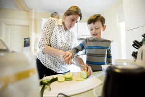SarahJoy Chaple receives help from her son Brian as she makes a snack for him after her workday. Kevin Bennett Photo