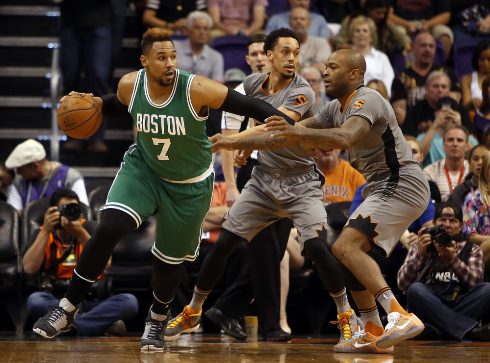 Boston Celtics center Jared Sullinger (7) drives on Phoenix Suns forward P.J. Tucker in the first quarter Saturday.