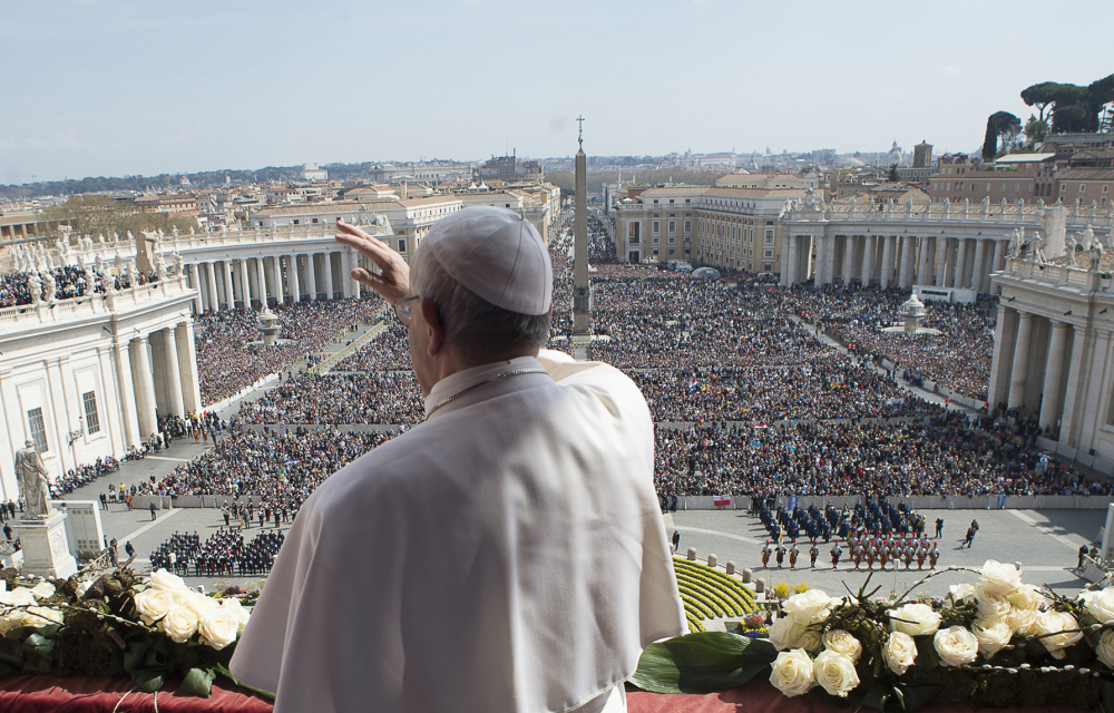 Pope Francis delivers his message at the end of Easter Mass in St. Peter’s Square at the Vatican on Sunday. He later made a swing through the square in his open-topped pope-mobile.