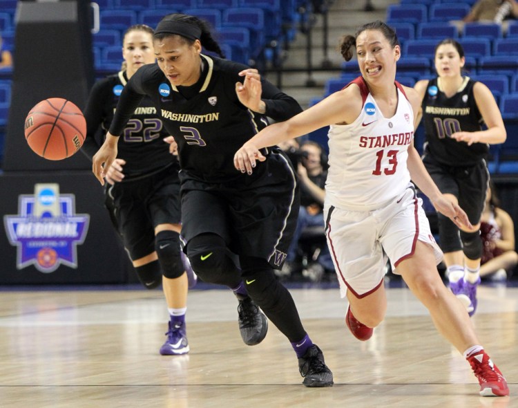 The Associated Press Washington’s Talia Walton, left, and Stanford’s Marta Sniezek (13) chase the ball during a regional final women’s college basketball game.