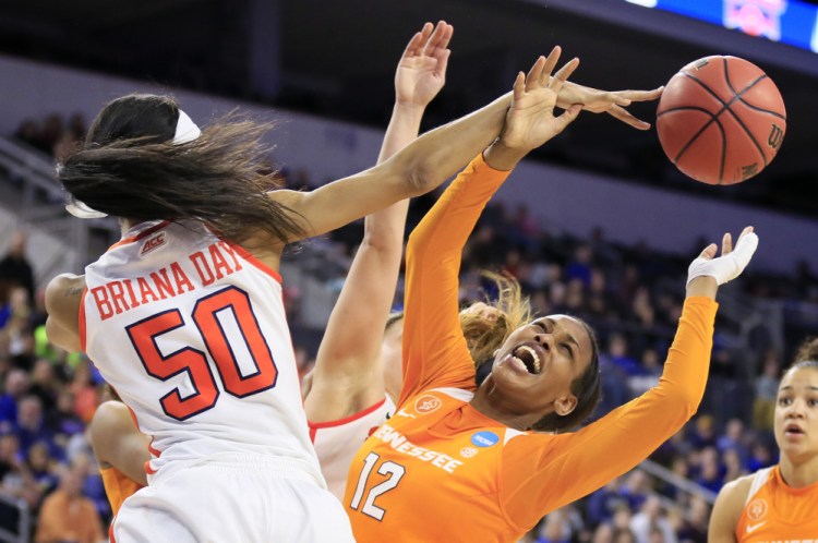 The Associated Press Tennessee forward Bashaara Graves (12) is fouled by Syracuse center Briana Day during the second half. Syracuse won 89-67.