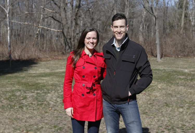 Amber and Zev Myerowitz Jr. stand Sunday at the site where they want to build a medical office and apartment complex in Cape Elizabeth. "We've basically designed the buildings that the town center planners wanted," Zev Myerowitz says. Joel Page/Staff Photographer