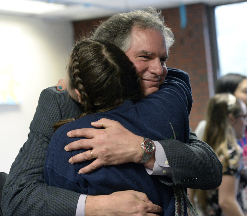 Casco Bay High School Principal Derek Pierce is hugged by a student after being named Maine's Principal of the Year on Monday.
Shawn Patrick Ouellette/Staff Photographer