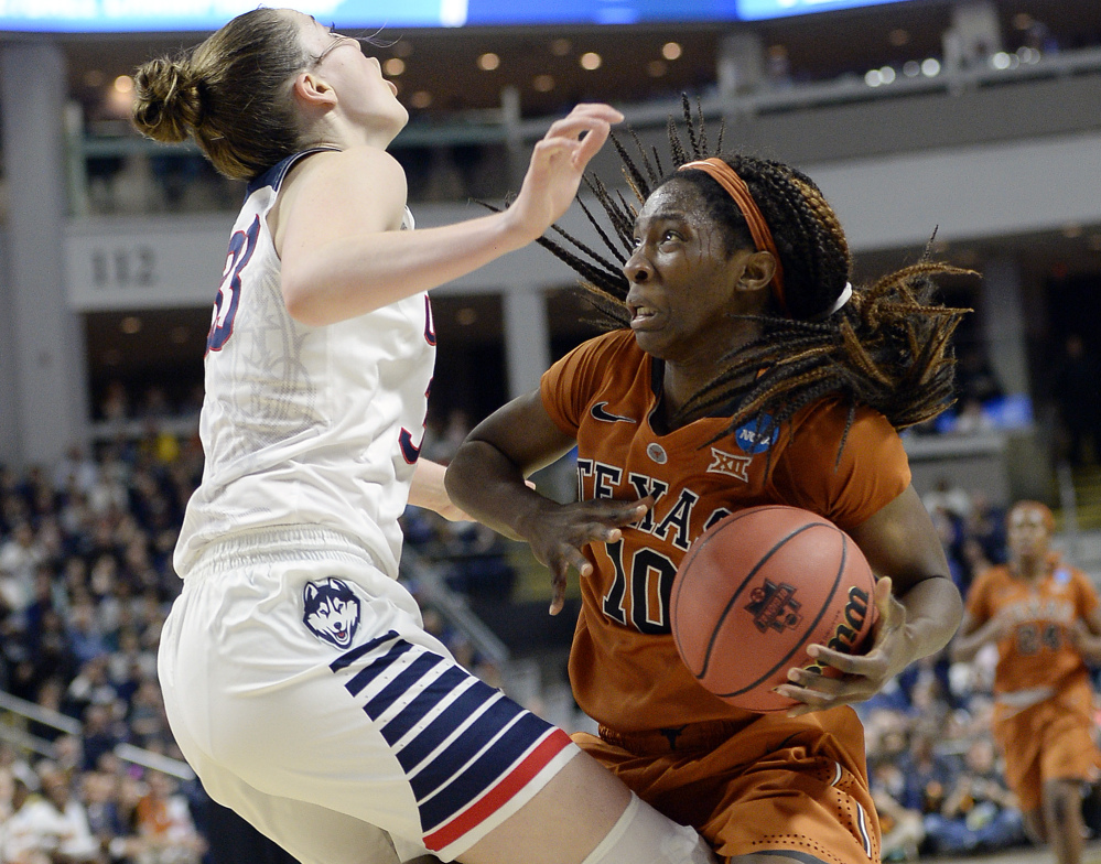Texas’ Lashann Higgs gets little room to move against Connecticut’s Katie Lou Samuelson.