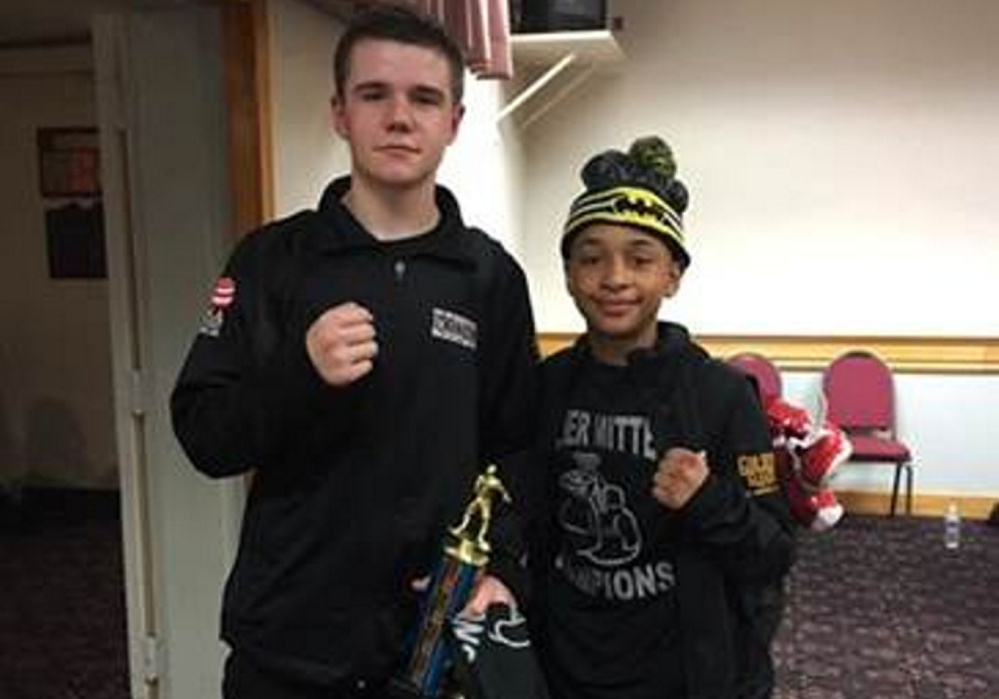 Brady Greenwood, 16, left, and Barry Wilson, 12, both of the Portland Boxing Club, won their classes at the New England Silver Mittens Championship in Billerica, Massachusetts.