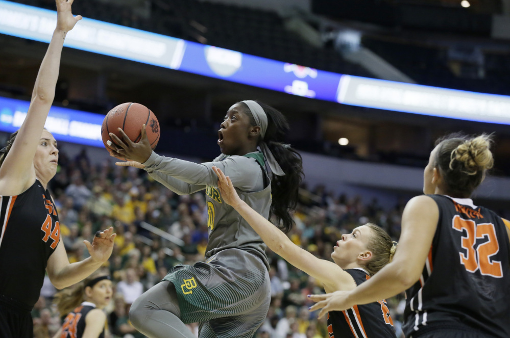 Baylor guard Alexis Jones drives against Oregon State defenders Ruth Hamblin (44), Jamie Weisner (15) and  Deven Hunter in the first half. Jones led Baylor with 19 points.