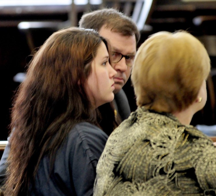 Kayla Stewart, center, listens to attorneys John Martin and Pamela Ames during arraignment in Somerset County Superior Court in Skowhegan on Tuesday.
