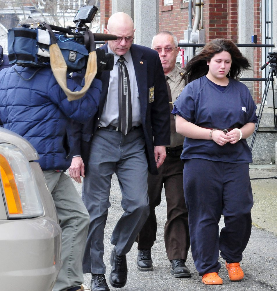 Kayla Stewart of Fairfield is led from Somerset County Superior Court in Skowhegan on Tuesday by deputies following her arraignment on charges in connection with the death of her newborn son. Stewart pleaded not guilty to charges of murder and manslaughter.