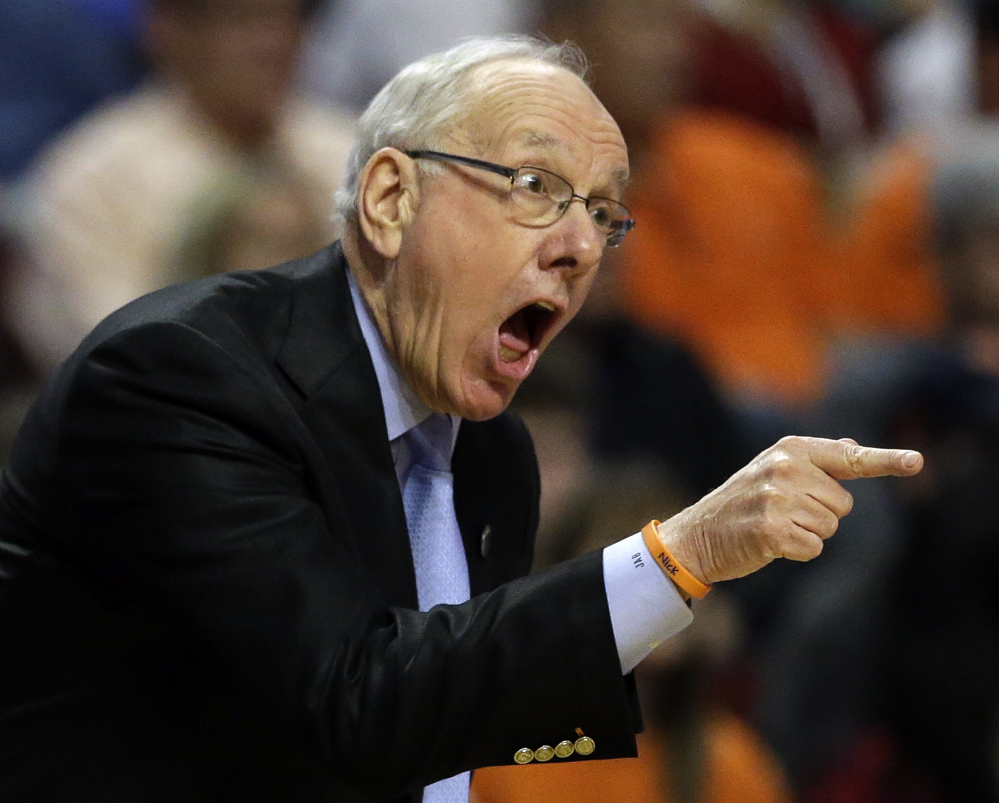 Syracuse Coach Jim Boeheim rejects the notion that his program cheated, describing the violations that led to his suspension earlier this season as "rules being broken."