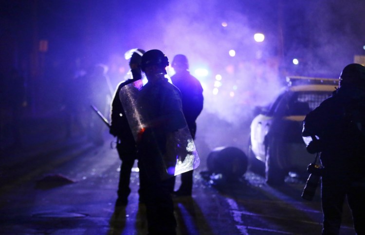 Tensions ran high in the days after the shooting of Michael Brown by a police officer in Ferguson, Missouri, in 2014. A think tank report that proposes retraining officers to avoid conflict whenever possible is meeting with opposition from officers around the country.