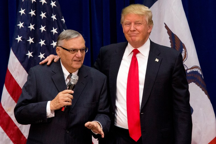 Republican presidential candidate Donald Trump is joined by Maricopa County, Ariz., Sheriff Joe Arpaio as a campaign event at the Roundhouse Gymnasium in Marshalltown, Iowa in the file photo.  The Associated Press