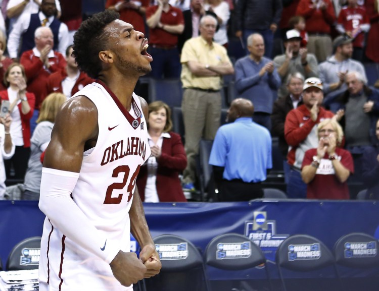 Oklahoma guard Buddy Hield shouts in front of the Oklahoma crowd following the Sooners' improbable second-round rally against Northern Iowa.   The Associated Press