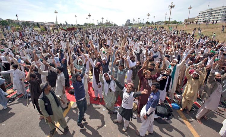 Protesters from Pakistan's Sunni Tehreek group chant slogans during a sit-in near the parliament building in Islamabad, Pakistan, Tuesday,  bringing the most sensitive parts of the nation's capital to a standstill. The Associated Press