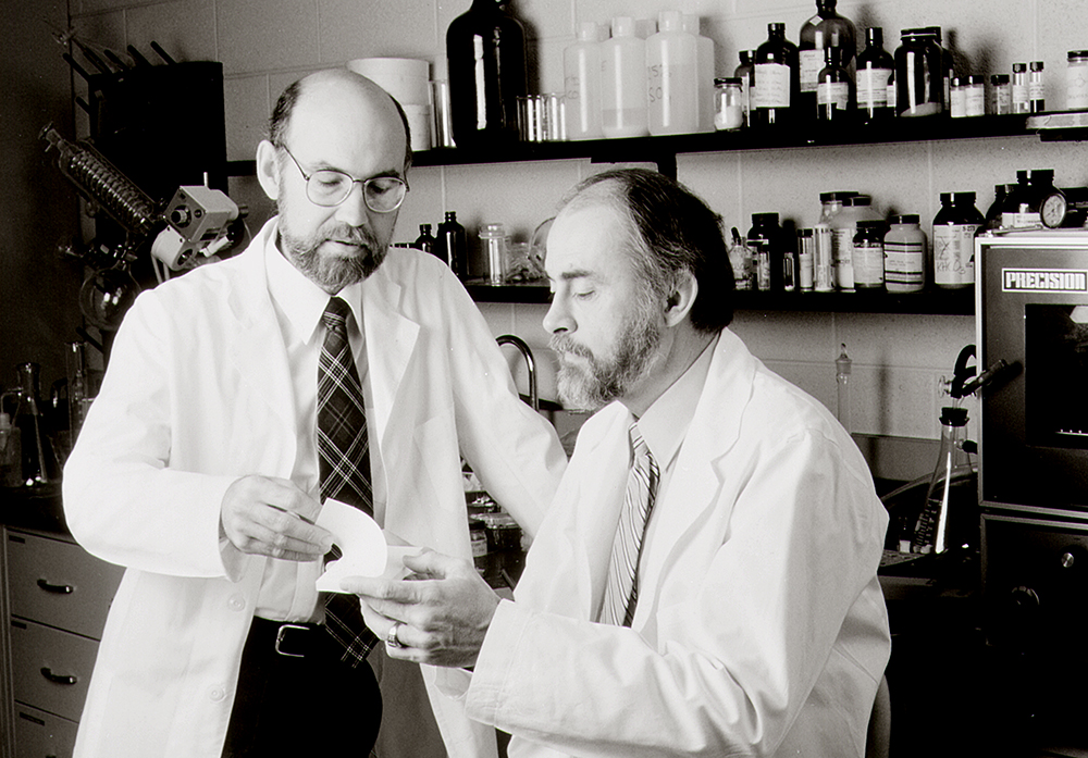 Spencer Silver, left, and Art Fry hold a Post-It Note pad. 3M says Fry and Silver developed the iconic product "without any input or inspiration from Mr. Amron and it is false and misleading for him to state or suggest that he created, invented, or had any role in the product's development." 3M photo via AP
