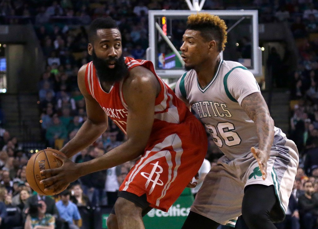 Rockets guard James Harden looks to make a move against Celtics guard Marcus Smart in the fourth quarter Friday in Boston. The Associated Press