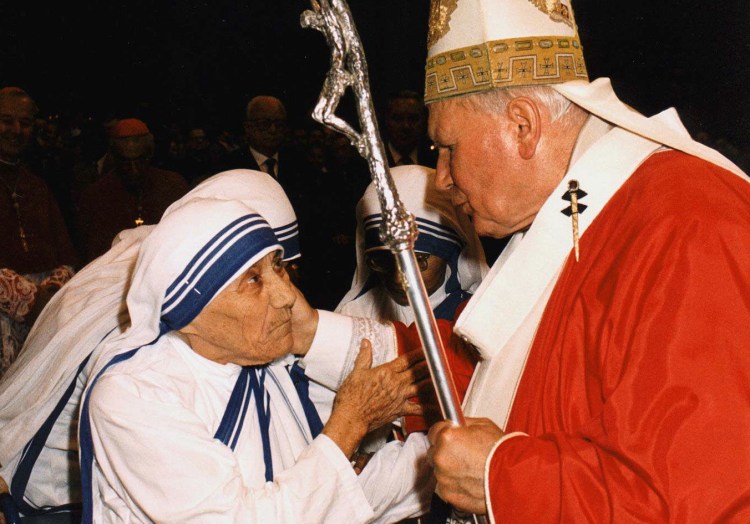 In this Sunday, June 29, 1997 filer, of  Pope John Paul II  greets Mother Teresa of Calcutta as they meet in St. Peter's Basilica at the Vatican. The Associated Press
