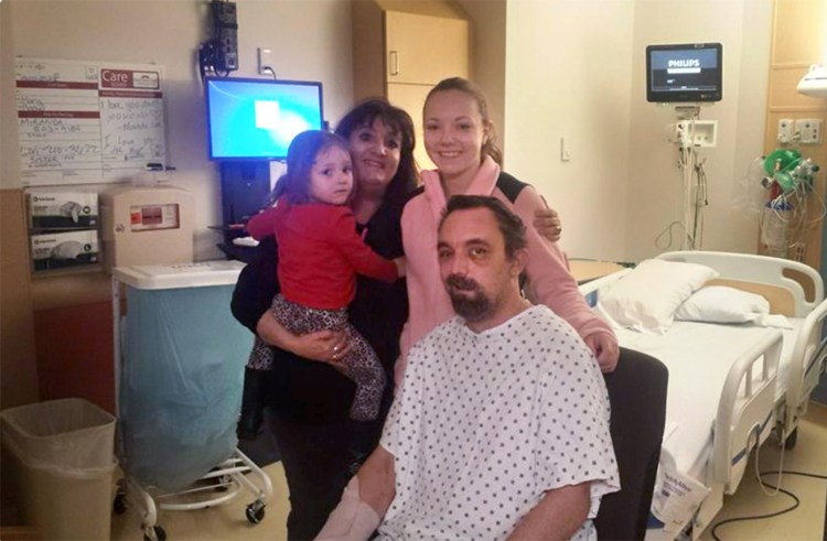 Paul Cady is shown with his daughter, Miranda, right, and other family members in his hospital room at Maine Medical Center, where he was recovering from a head injury suffered in a motorcycle accident. Miranda Cady said her father was not suicidal and was eager to return home. 