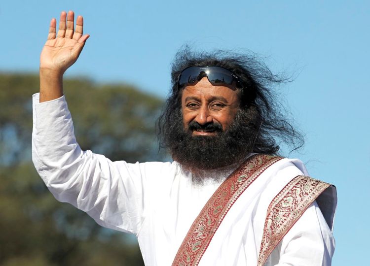 Hindu spiritual leader Sri Sri Ravi Shankar acknowledges his followers before an open-air meditation day organized by the Art of Living foundation in Buenos Aires in this 2012 photo. Reuters