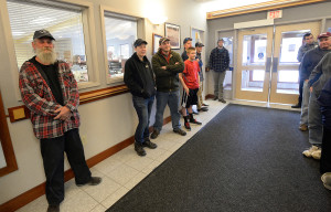 A small crowd gathered at Scarborough's town hall for the drawing for a commercial shellfish license. David Green, left, who already had a license, said there's enough competition on the flats and he hoped his sister-in-law would win the license Friday because he didn’t think she’d end up using it.
