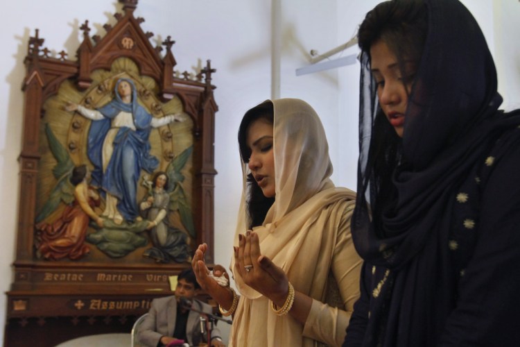 Women pray during Easter Mass at St. Joseph Cathedral in Rawalpindi, Pakistan. There are about 100 million more religiously affiliated women on the planet than men.