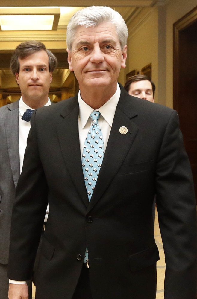 Mississippi Republican Gov. Phil Bryant leaves a news conference Friday.