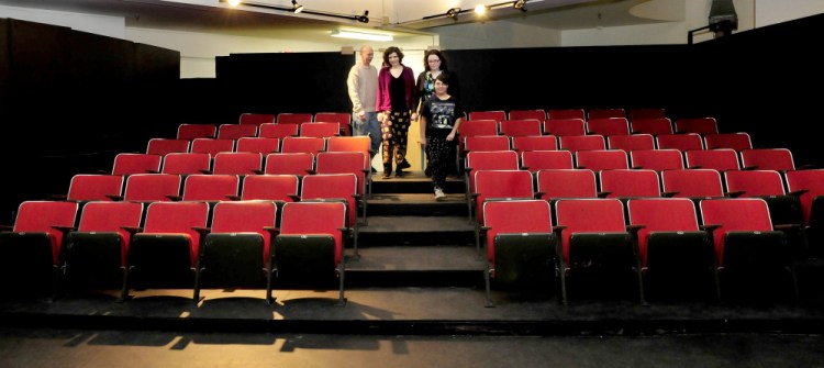 Out & Allied Youth Theatre members walk down the aisle in the theater in The Center in Waterville on Thursday. From left are Mark Fairman, Lily Fernando, Katie Howes and Rory Romero.
