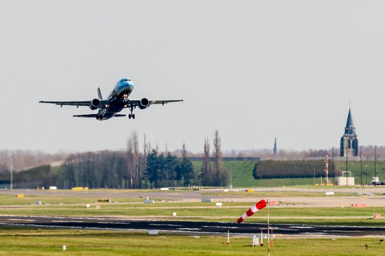 A plane takes off at Brussels Airport Sunday.  Three flights were scheduled to take off, the first since the March 22 bombing.  