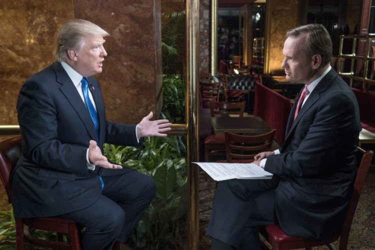 Republican presidential candidate Donald Trump speaks with John Dickerson on Friday in New York for "Face The Nation" on CBS.