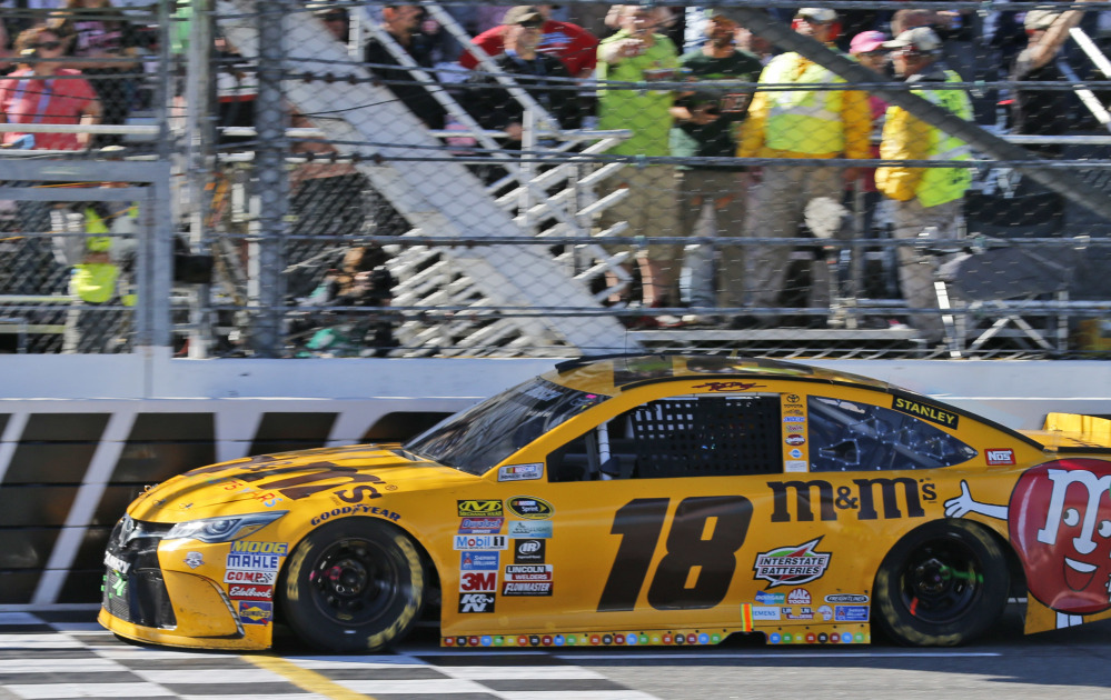 Kyle Busch crosses the finish line to win Sunday's Sprint Cup race at Martinsville Speedway. Busch led 352 of 500 laps on the way to his 35th career Sprint Cup victory.